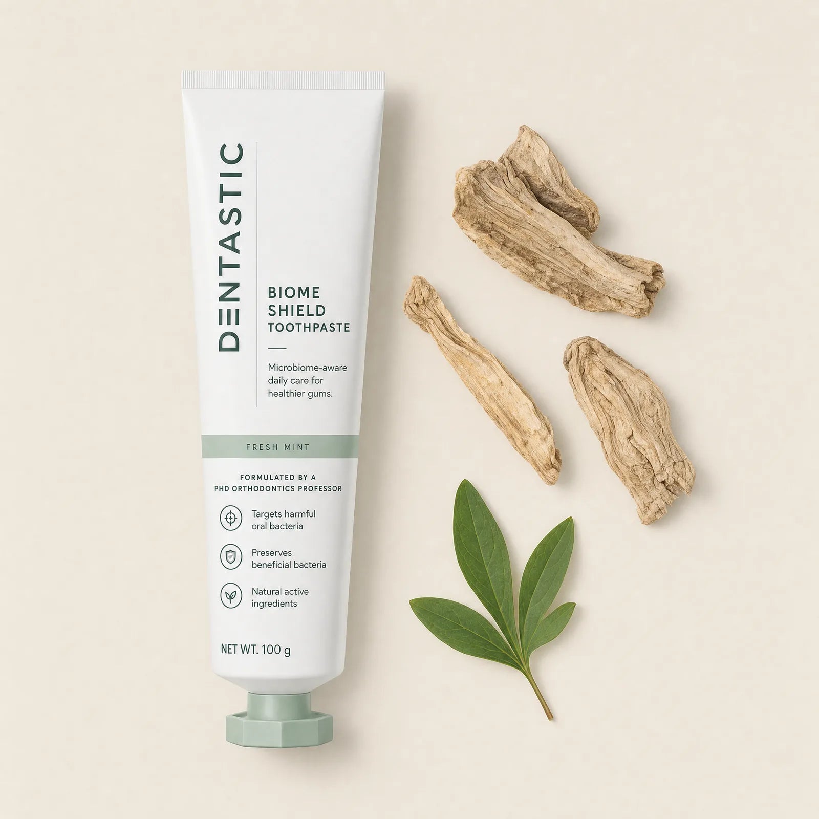 The DENTASTIC tube laid out with peony root and leaf