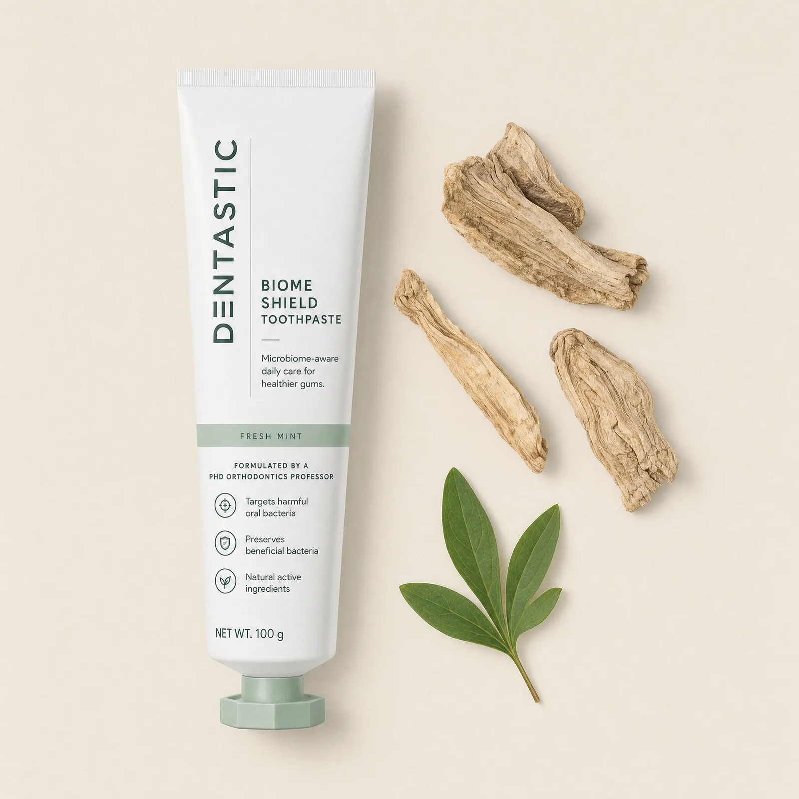 The DENTASTIC tube laid out with peony root and leaf
